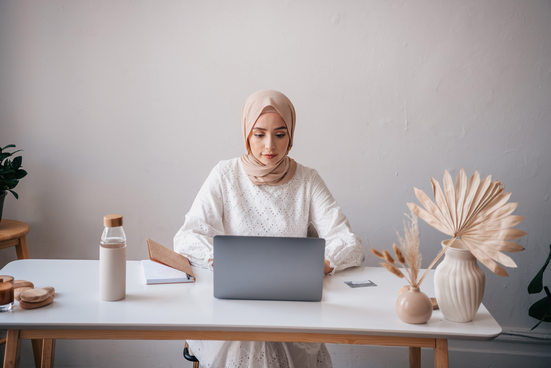 Woman with a Beige Hijab Working on Her Laptop